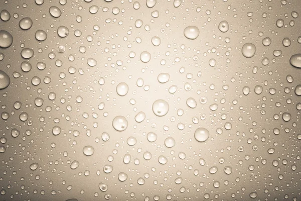 Wassertropfen auf einem farbigen Hintergrund. Grau. gemildert — Stockfoto
