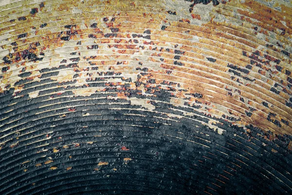 The bottom of the old metal frying pan. Toned — Stock Photo, Image