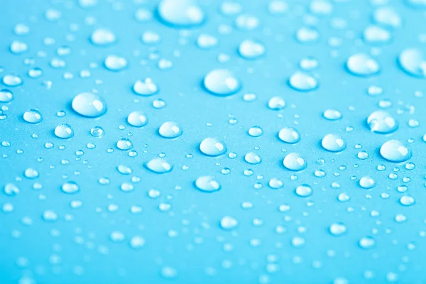 Drops of water on a color background. Blue. Shallow depth of fie — Stock Photo, Image