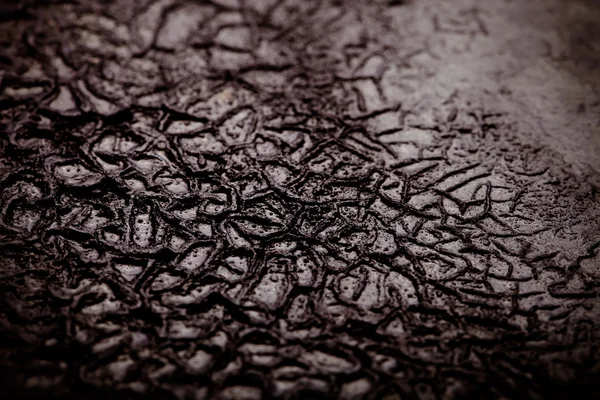 The bottom of the old cast-iron frying pan. Selective focus. Ton — Stock Photo, Image