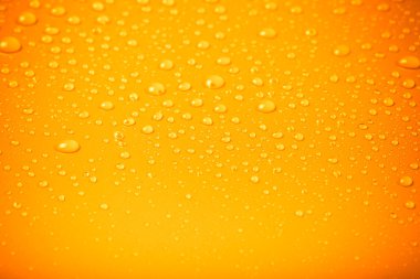 bir renk arka plan üzerinde Su damlacıkları. Turuncu. f sığ derinliği