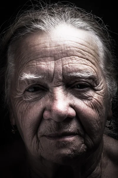 Portrait of elderly woman. Serious. Toned — Stock Photo, Image