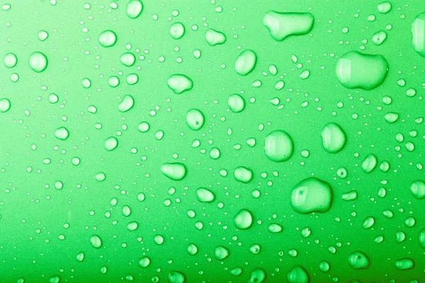 Drops of water on a color background. Green. Toned — Stock Photo, Image