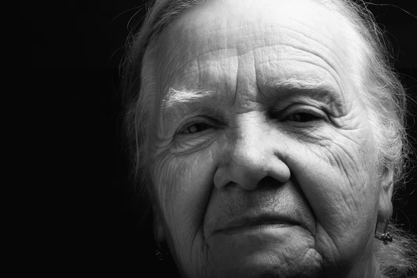 Portrait of elderly woman. Serious. Toned — Stock Photo, Image