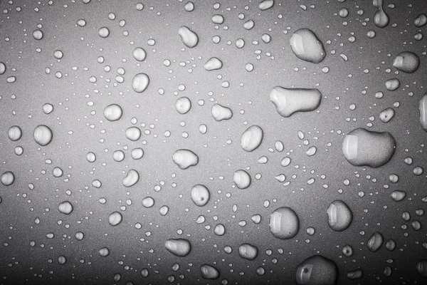 Gotas de agua sobre un fondo de color. Gris. Tonificado — Foto de Stock