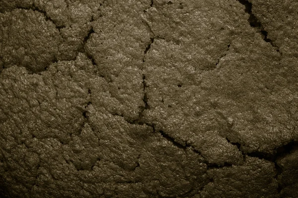 Top of fresh chocolate cake with cracks. Toned — Stock Photo, Image