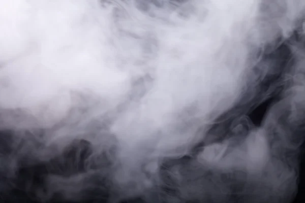 Cloud of smoke on black background. Selective focus — Stock Photo, Image