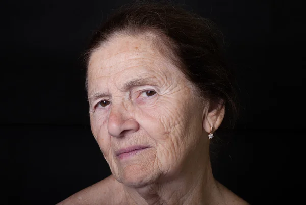 Portrait of elderly woman. Attentiveness — Stock Photo, Image