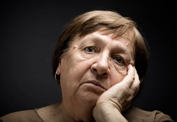 Portrait of elderly woman. Sorrow. Toned — Stock Photo, Image