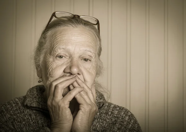 Portrait of elderly woman in glasses. Toned — Stock Photo, Image