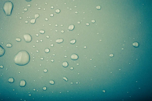 Gotas de água em um fundo a cores. Verde. Tonificado — Fotografia de Stock