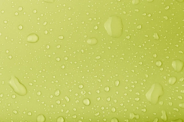 Gotas de água em um fundo a cores. Tonificado — Fotografia de Stock