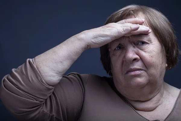 Portrait of elderly woman. Question. Toned — Stock Photo, Image