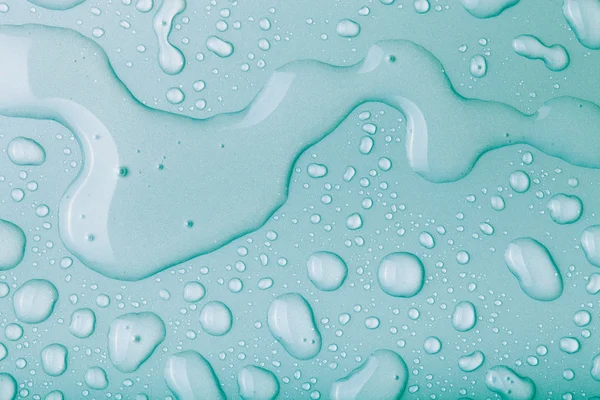 Drops of water on a color background. Blue. Toned — Stock Photo, Image