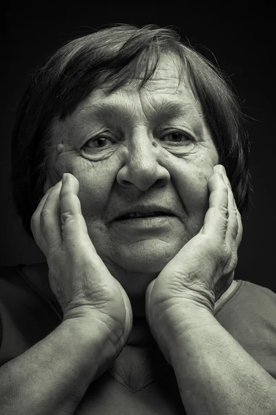 Portrait of elderly woman. Question. Toned — Stock Photo, Image