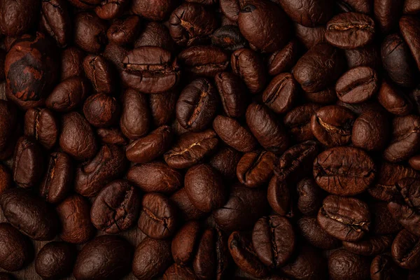 Pražená Kávová Zrna Starém Tmavém Dřevěném Pozadí Pro Tapety Nebo — Stock fotografie