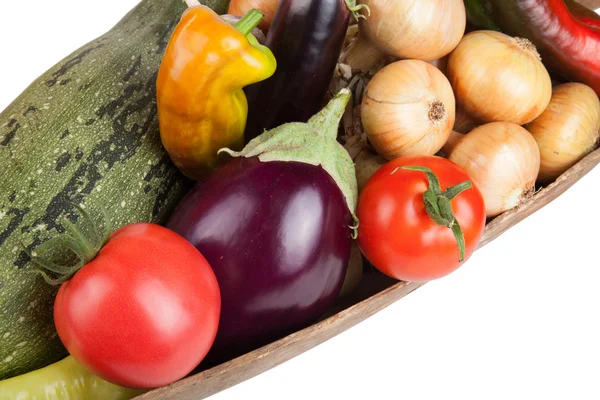 Assorted vegetables lying in a wooden scoop isolated on white background — Stock Photo, Image