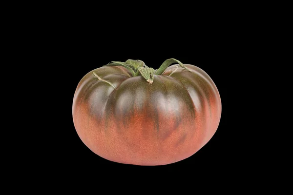 Tomato green and red with a crack isolated on black background — Stock Photo, Image