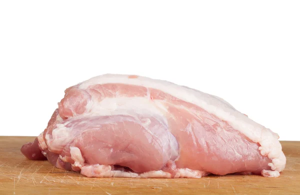 Pedaço de carne deitado em um tabuleiro isolado no fundo branco — Fotografia de Stock