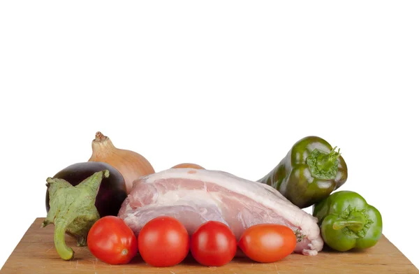 Vegetables with meat lying on a board isolated on white backgrou — Stock Photo, Image