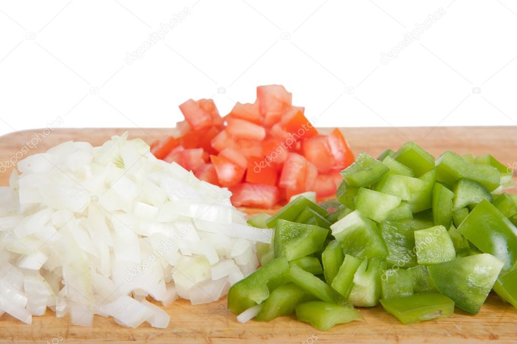 Tomato, sweet pepper and onion on a board isolated on a white ba