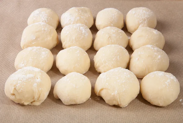 Small balls of dough with flour for pizza or cakes and scones ly — Stock Photo, Image