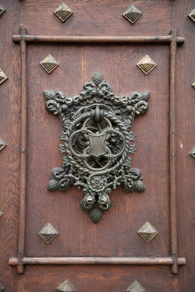 Forged old doorknob with a pattern — Stock Photo, Image