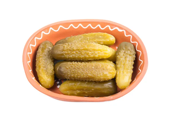 Pickled cucumbers in traditional ceramic bowl isolated on white — Stock Photo, Image