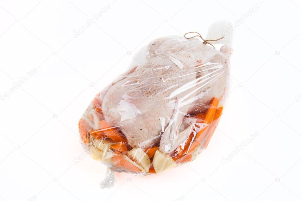 Chicken for frying with vegetables in a package 