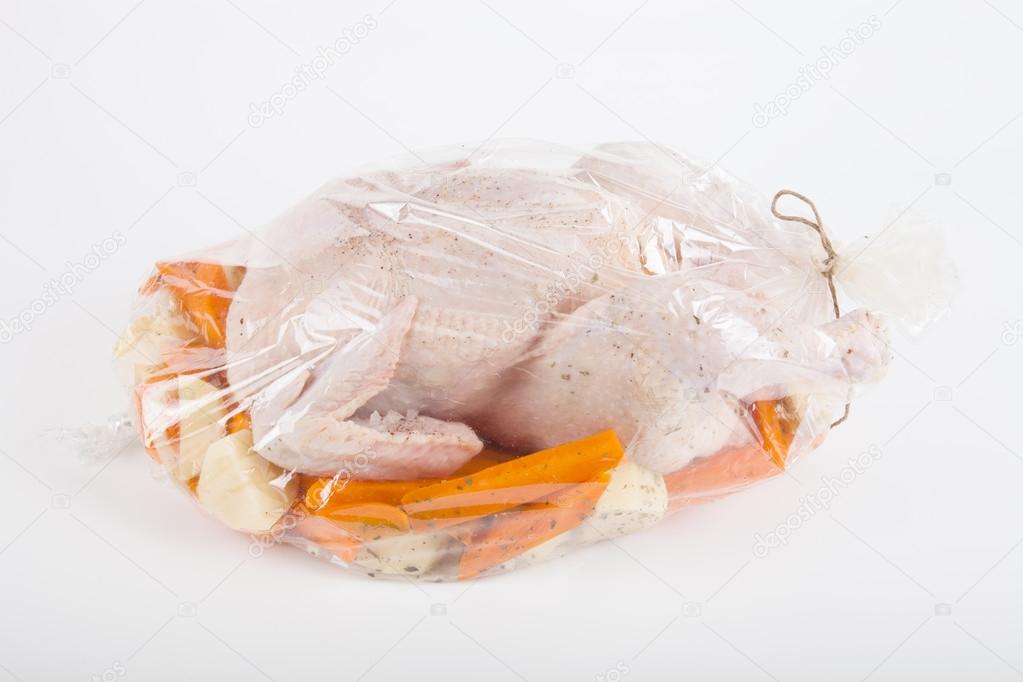 Chicken for frying with vegetables in a package