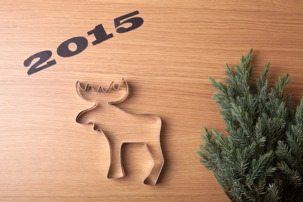 Inscription 2015 Christmas tree and form of  moose on a wooden t — Stock Photo, Image