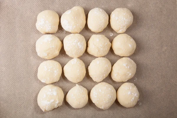 Small balls of dough with flour for pizza or cakes and scones on — Stock Photo, Image