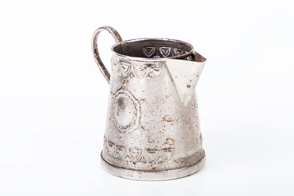 Old coffee pot without cover with spots of rust on a white backg — Stock Photo, Image