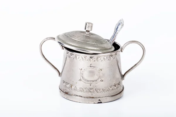 Old sugar bowl with lid and spoon with spots of rust on a white — Stock Photo, Image