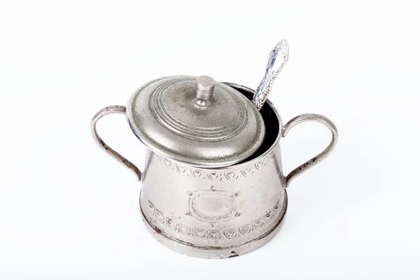 Old sugar bowl with lid and spoon with spots of rust on a white — Stock Photo, Image