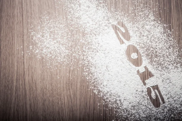 Inscription 2015 on flour on a wooden table — Stock Photo, Image