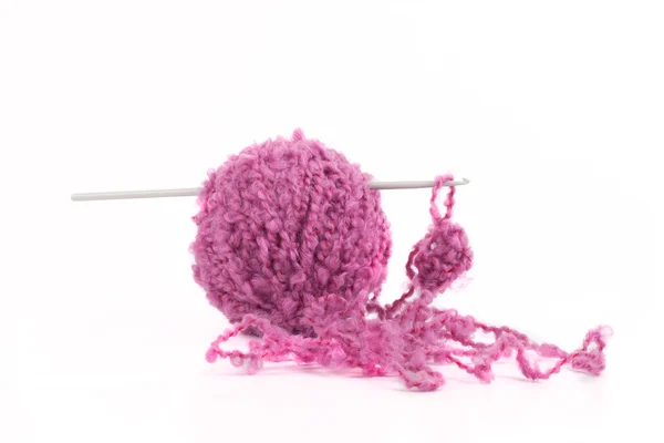 Skein of purple wool and a hook on a white background — Stock Photo, Image