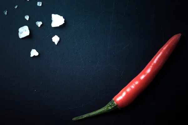 Red hot chili peppers on a blackboard. With space for text. tint — Stock Photo, Image