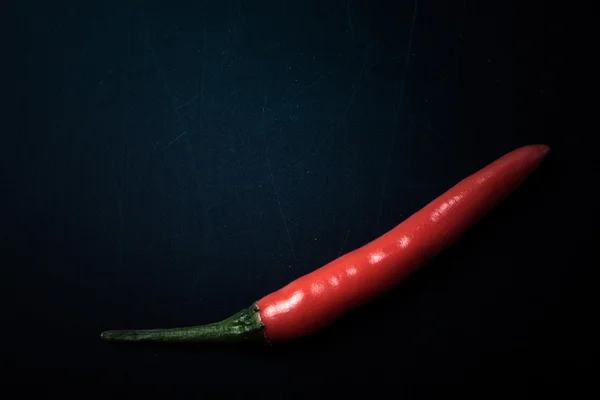 Red hot chili peppers on a blackboard. With space for text. tint — Stock Photo, Image