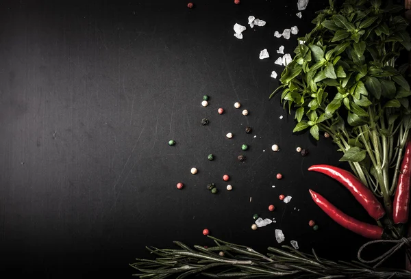 Herbs and spices. basil, red pepper, salt and rosemary on a blac — Stock Photo, Image
