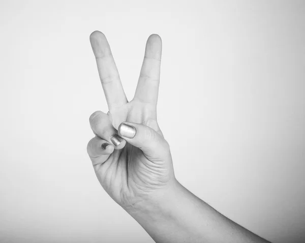 Rukou gesto, což znamená "vítězství" — Stock fotografie