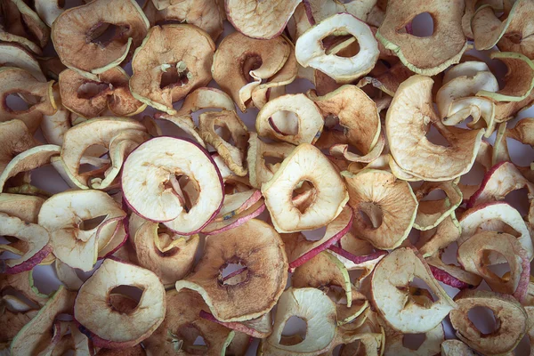 Rodajas secas de manzanas. Antecedentes teñido — Foto de Stock