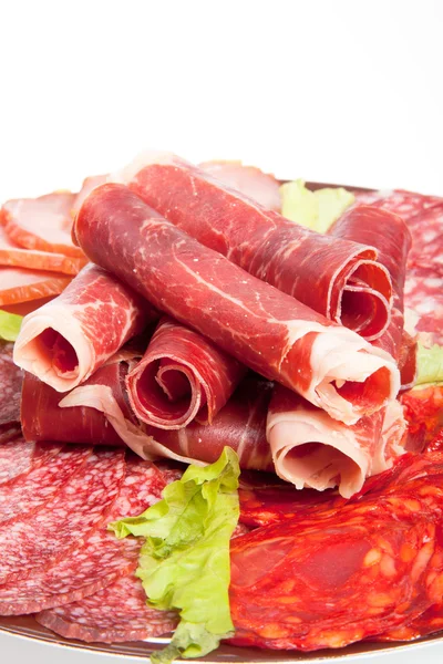 Slices of different kinds of meat with green salad — Stock Photo, Image