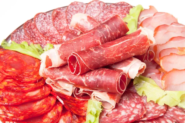 Slices of different kinds of meat with green salad — Stock Photo, Image