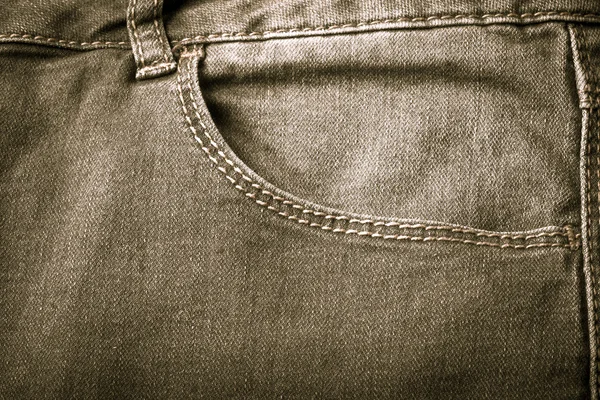 The pocket of jeans. Cloth background. Toned — Stock Photo, Image