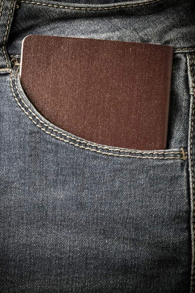 De zak van jeans met document. Doek achtergrond. Afgezwakt — Stockfoto