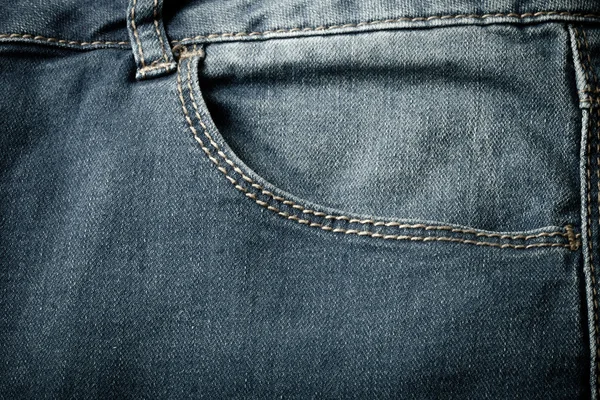 The pocket of jeans. Cloth background. Toned — Stock Photo, Image