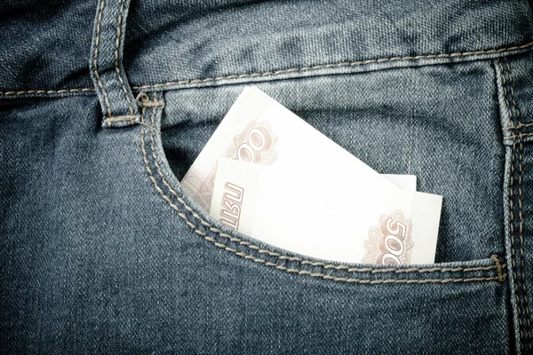 Die Hosentasche mit Geld. Stoffhintergrund. gemildert — Stockfoto