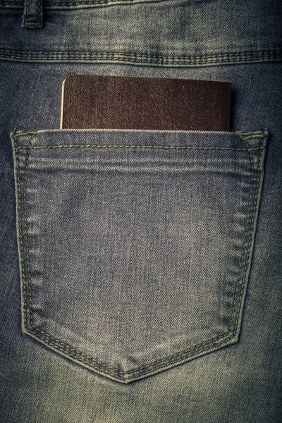 De zak van jeans met document. Doek achtergrond. Afgezwakt — Stockfoto