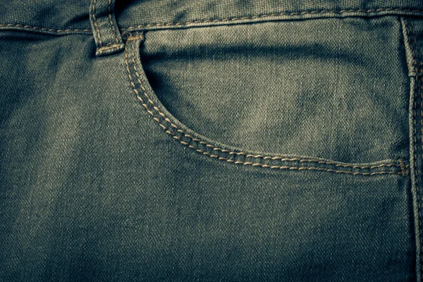 Fickan på jeans. Trasa bakgrund. Tonas — Stockfoto